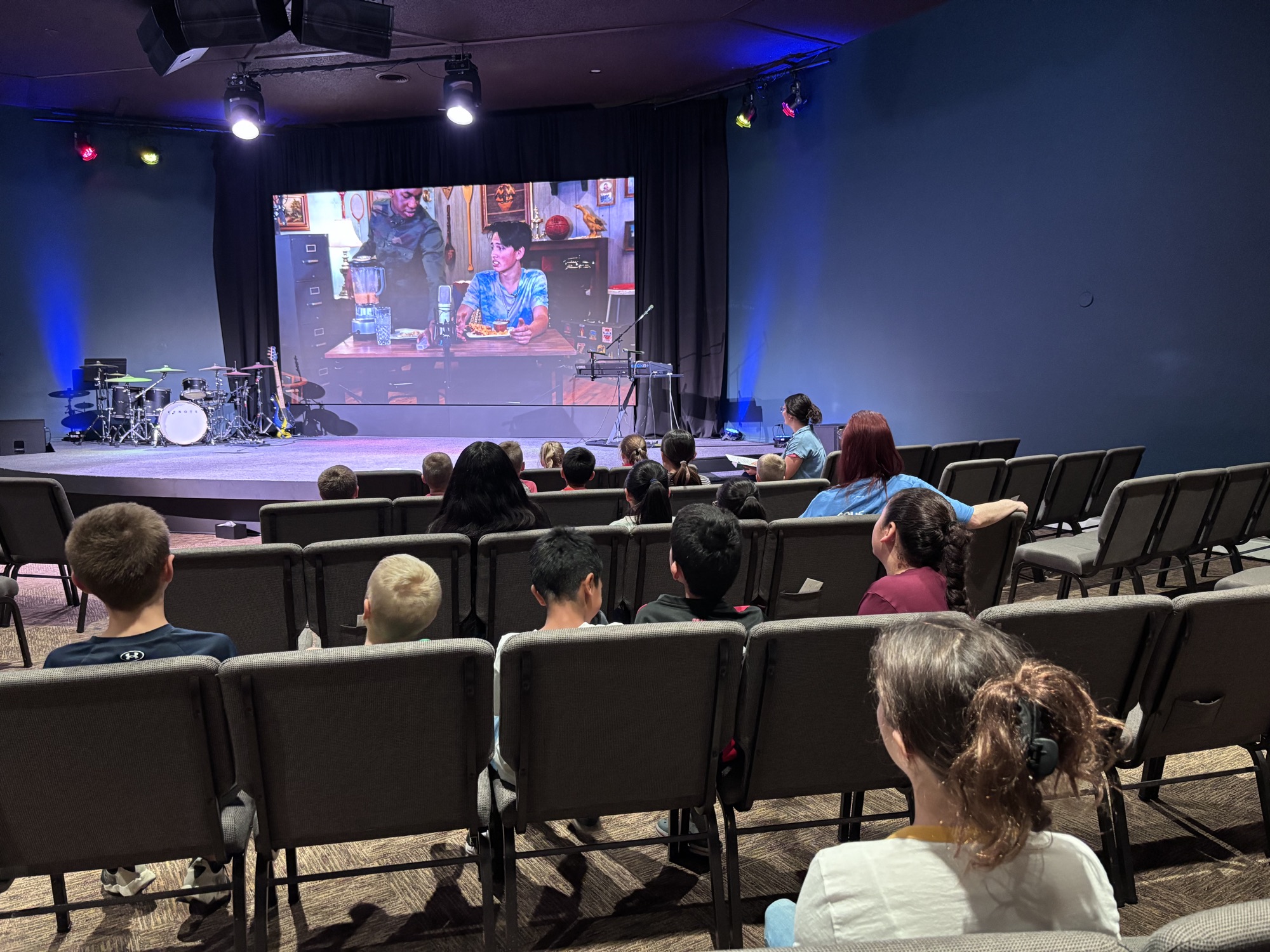Kids watching the AWANA lesson in the sanctuary