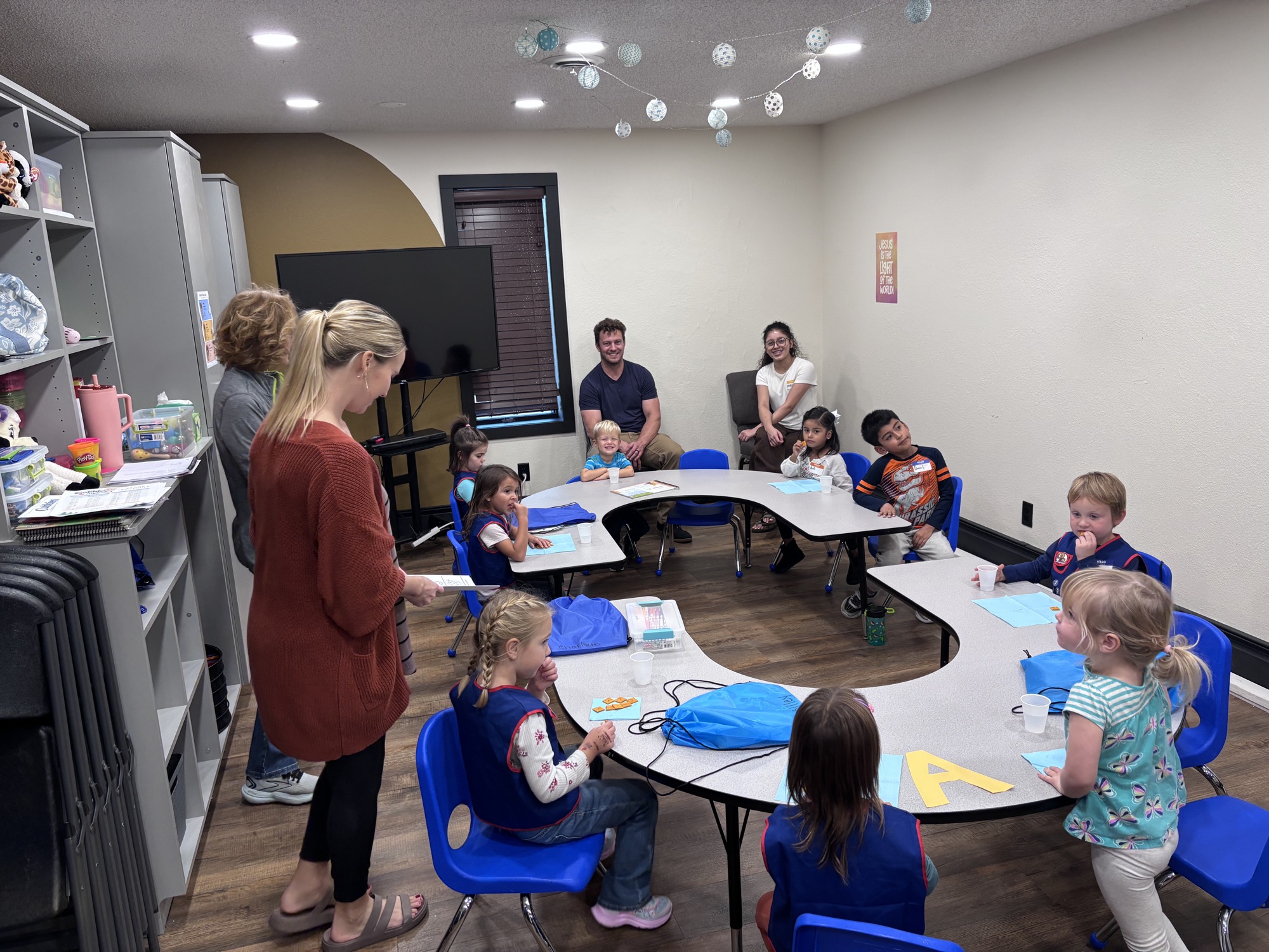 Kids at a table with their AWANA leaders