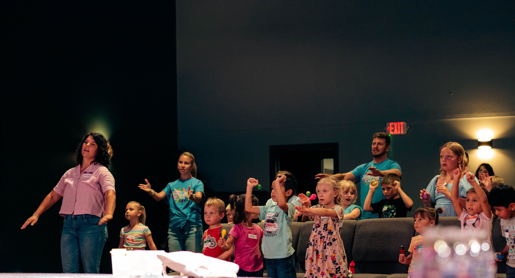 Kids doing worship motions